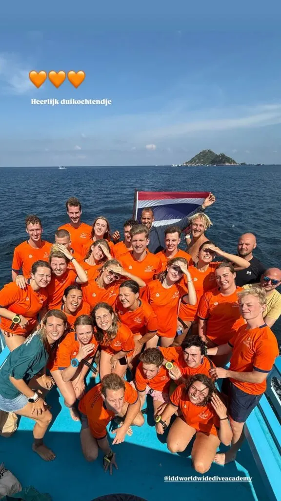 Impian Divers team on the boat with Dutch flag